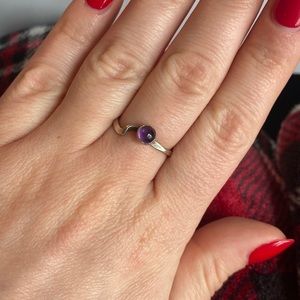 Silver ring with purple stone